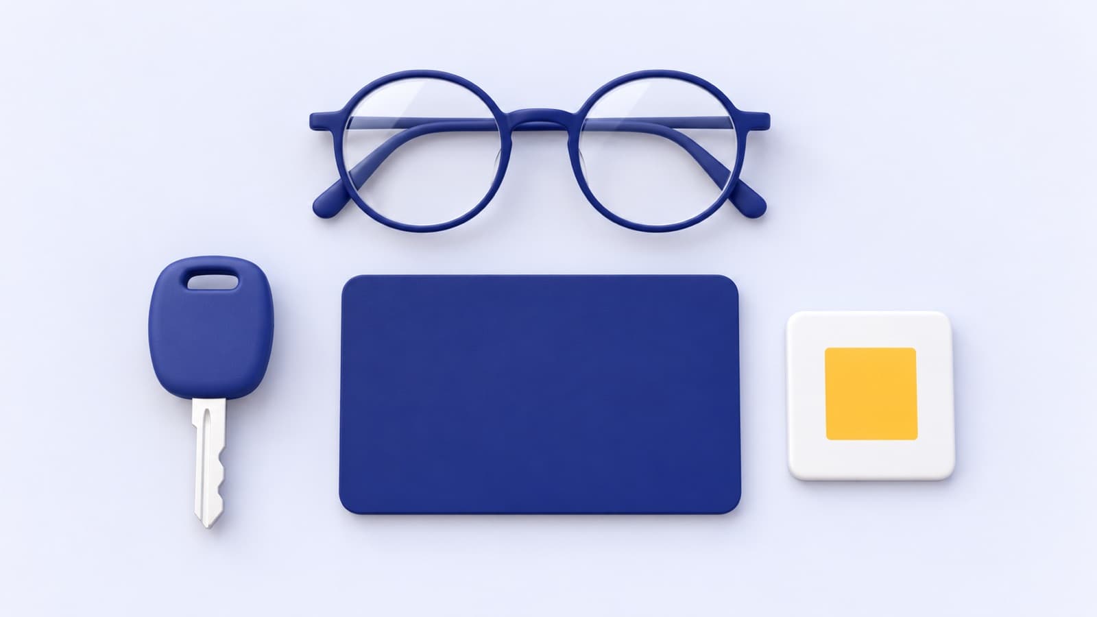 Glasses, a car key, a blank licence card and a gold square laid out neatly